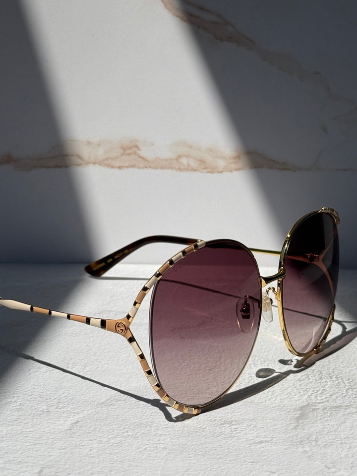 Gucci GG0595S Oversized Cutout Round Sunglasses in Brown Gradient