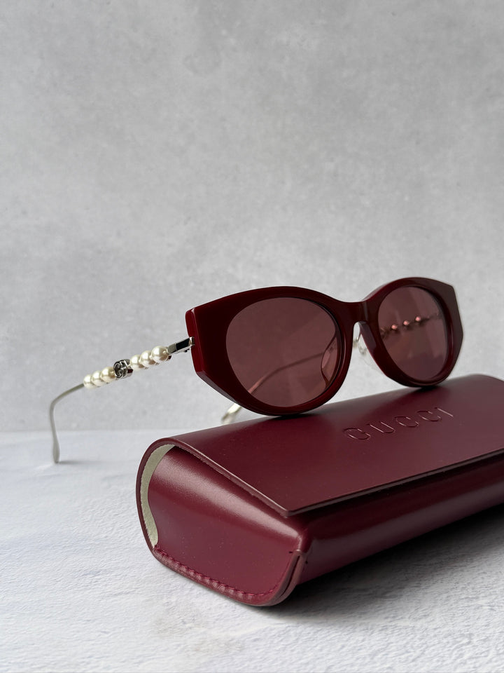Gucci GG1257S Gafas de sol redondeadas con lentes marrones y rojos