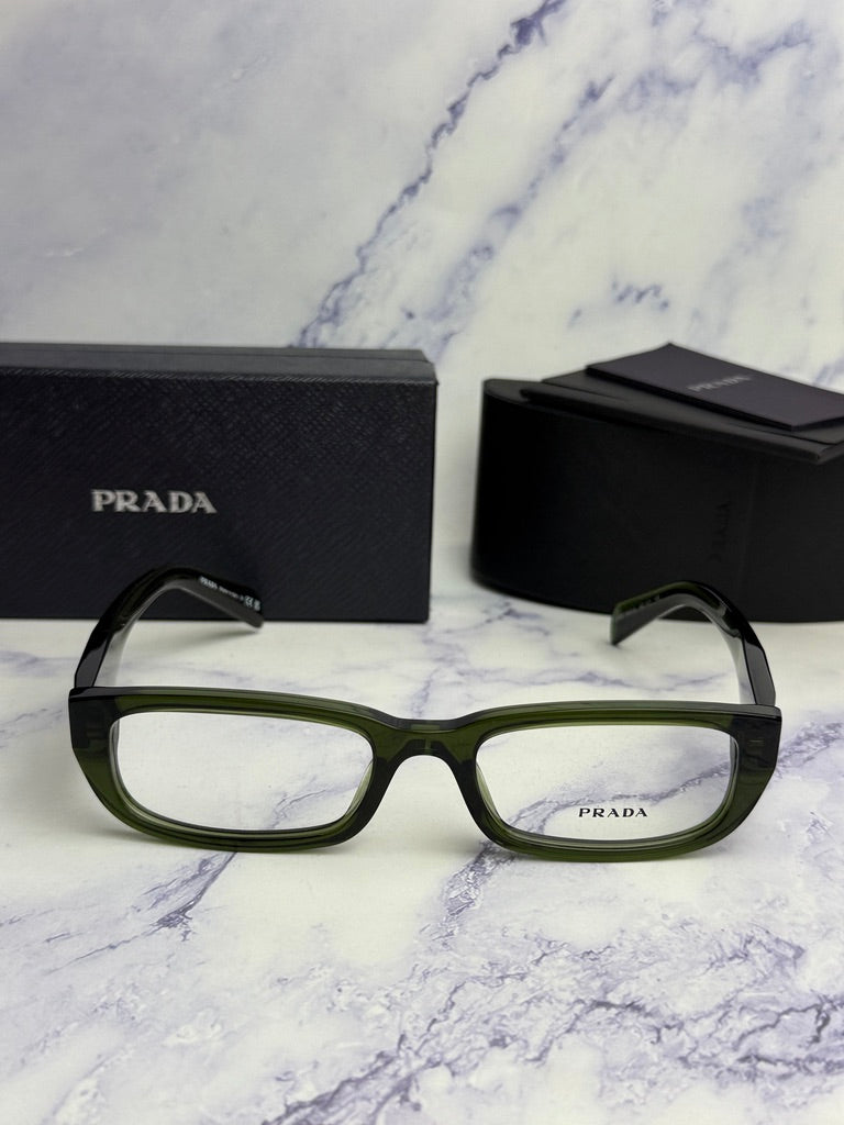 Transparent green rectangular eyeglass frames with black Prada case and box.