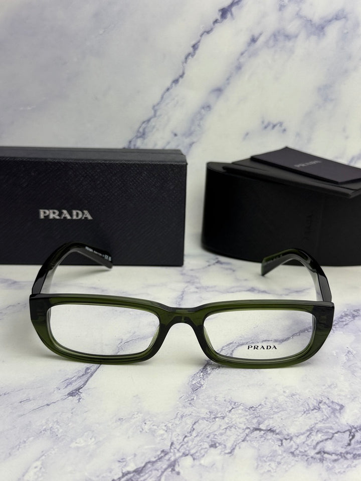Transparent green rectangular eyeglass frames with black Prada case and box.