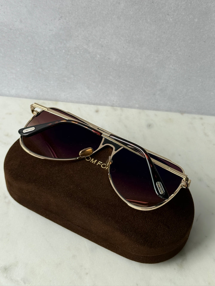 Rose gold pilot sunglasses, side view with dark tinted lenses and temple details
