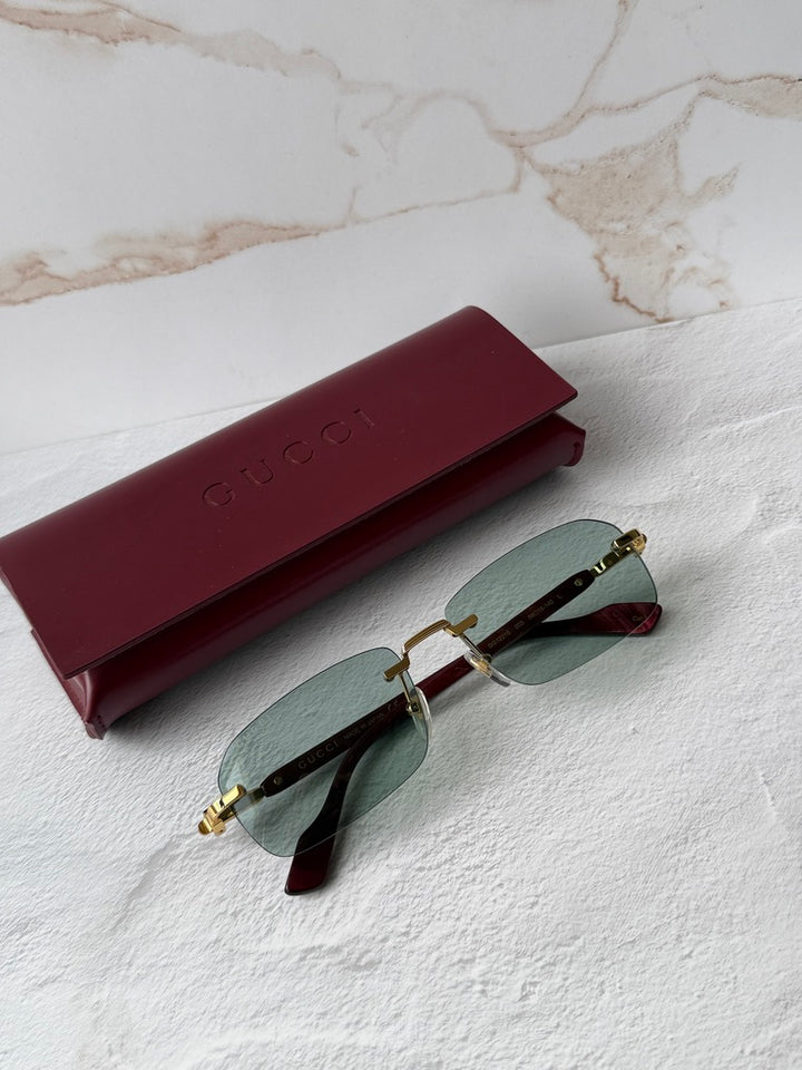 Gucci GG1221S Green Tinted Rimless Sunglasses