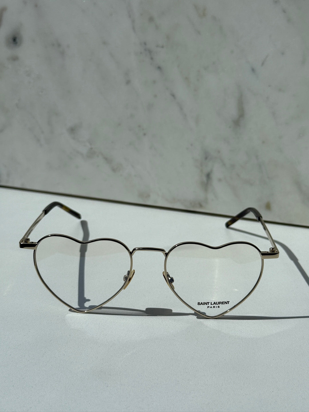 Saint Laurent LouLou optical frames, gold metal, heart-shaped clear lenses, front view