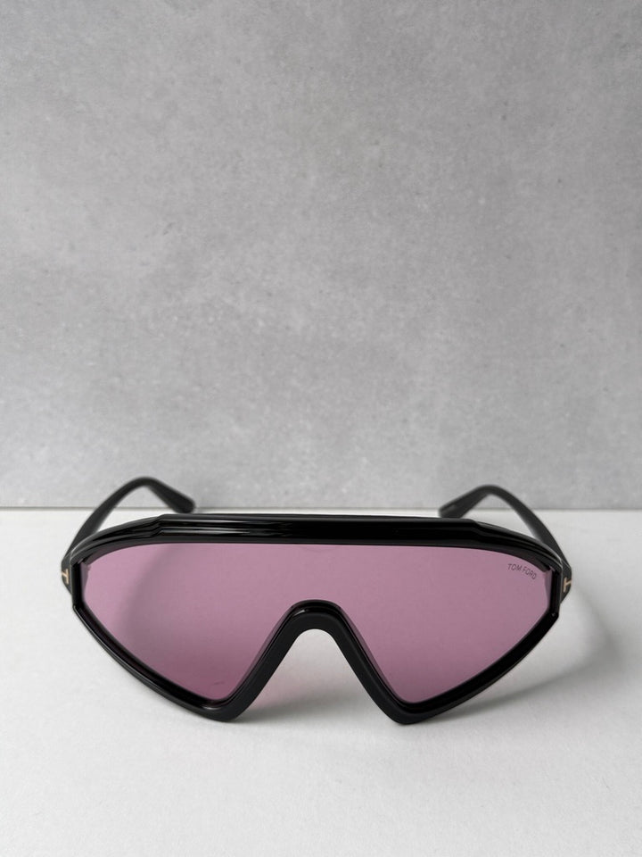 Black wrap sunglasses with pink-tinted lenses, shield shape