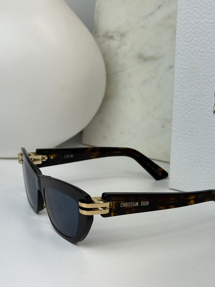 Havana brown Dior sunglasses side view with blue-tinted lenses and gold hinge accents