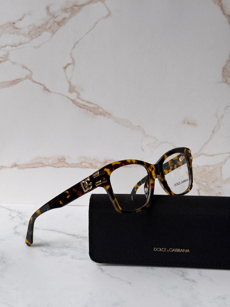 Tortoise-brown square eyeglass frames with gold DG logo on temple tips