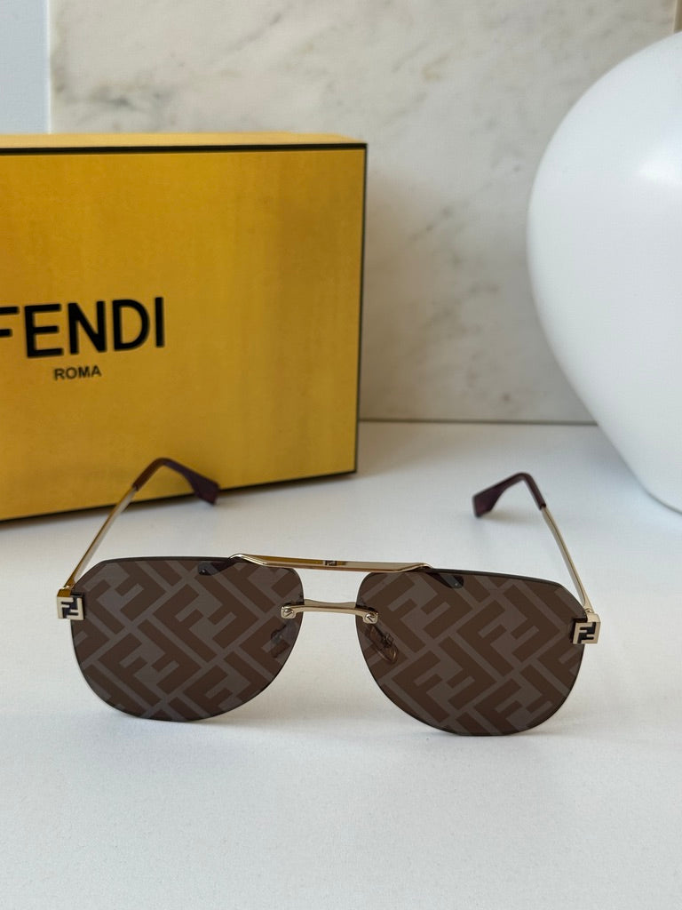 Front view rimless gold aviator sunglasses with brown FF-pattern lenses and Fendi FF logo