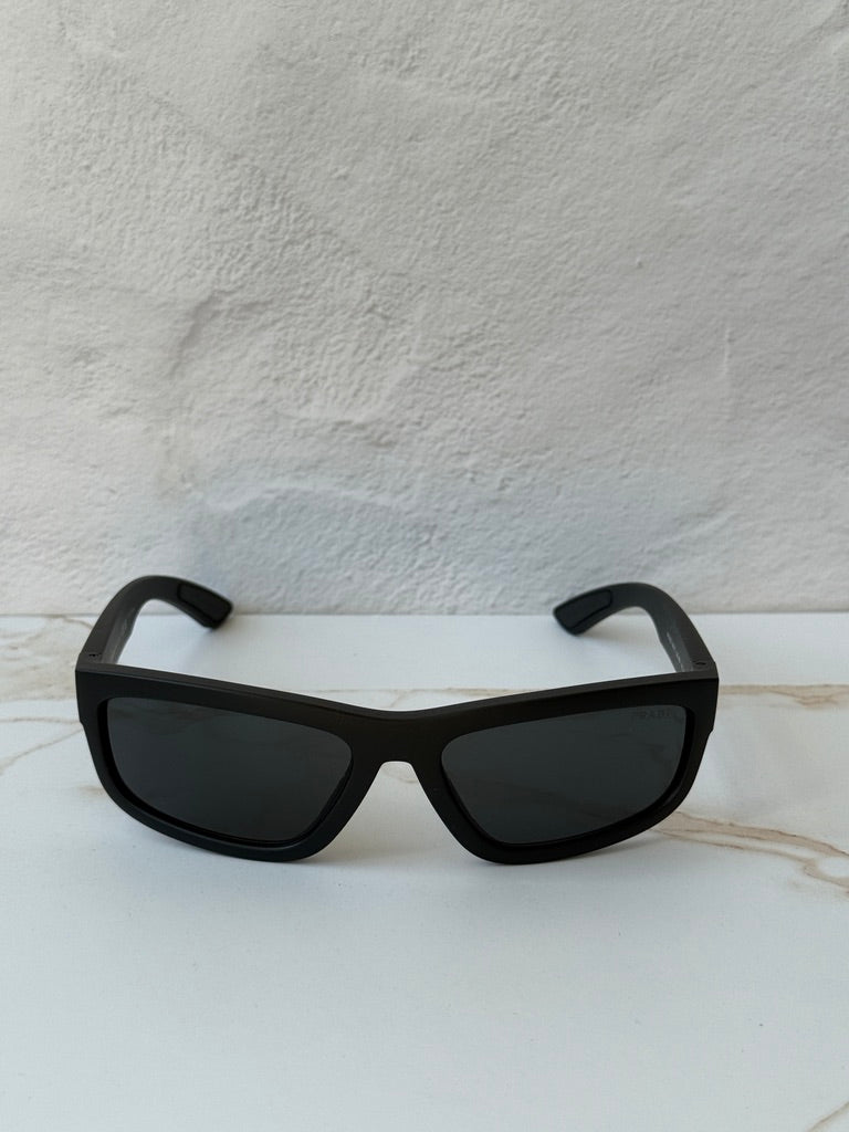 Black Prada Sport sunglasses with dark lenses and wide square frames