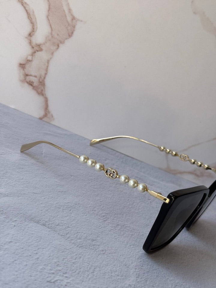 Gucci GG1257S Gafas de sol redondeadas con lentes marrones y rojos