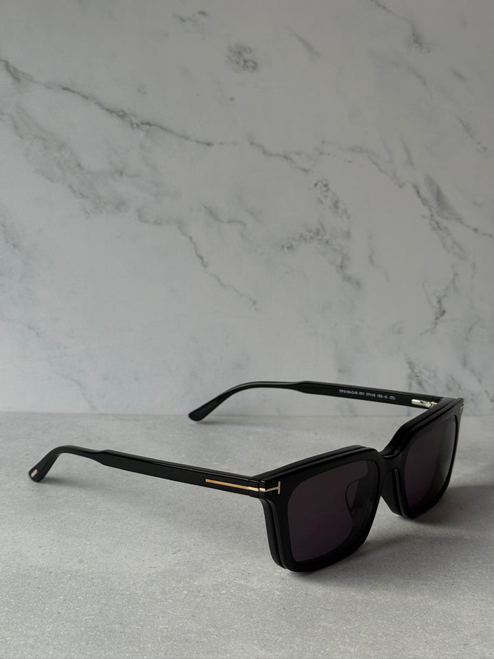 Black rectangular sunglasses angled view with purple-tinted dark lenses
