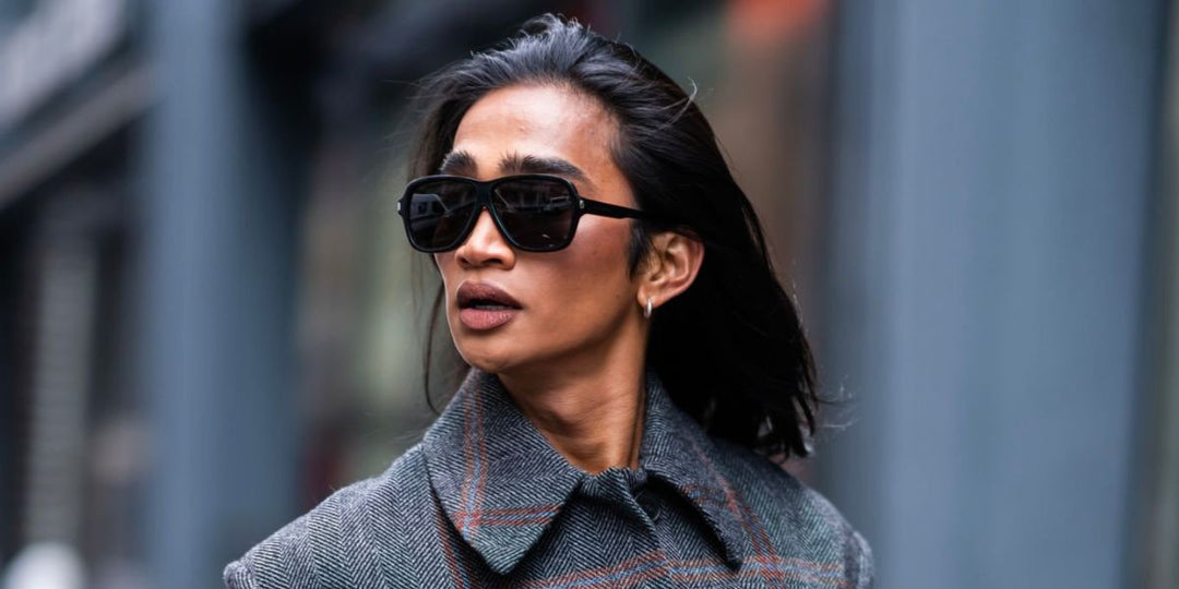 Saint Laurent SL609 black oversized sunglasses, side view with dark lenses