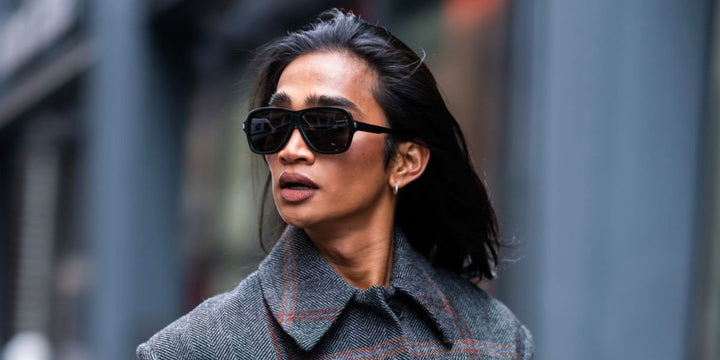 Saint Laurent SL609 black oversized sunglasses, side view with dark lenses