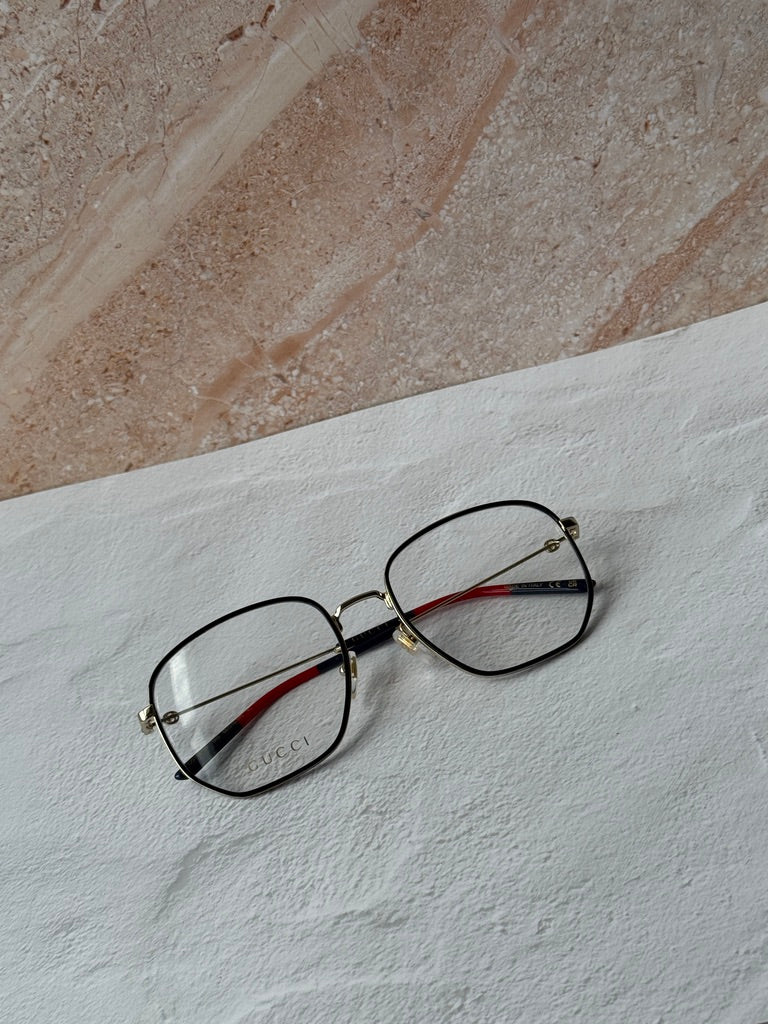 Gucci square eyeglasses, black frame with red temple tips and gold accents