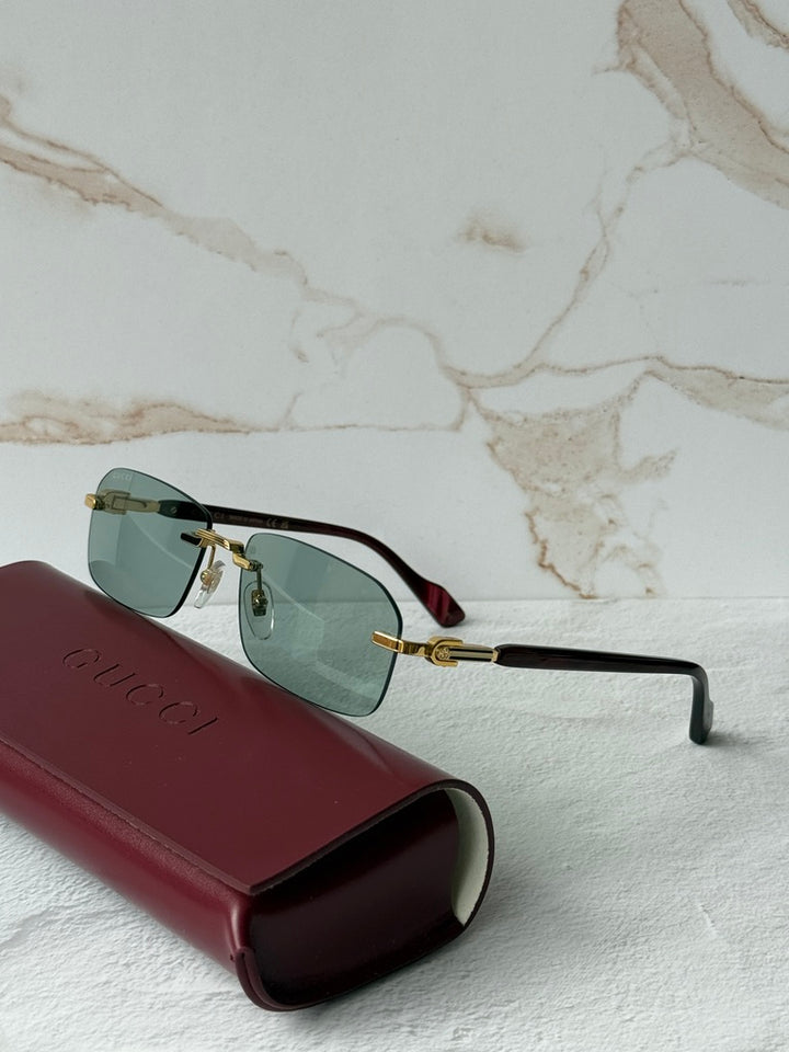 Gucci GG1221S Green Tinted Rimless Sunglasses