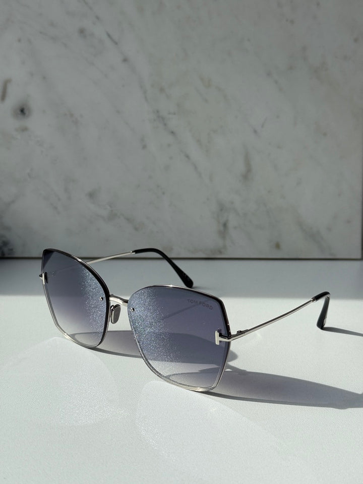 Silver grey metal sunglasses with dark gradient lenses in side profile