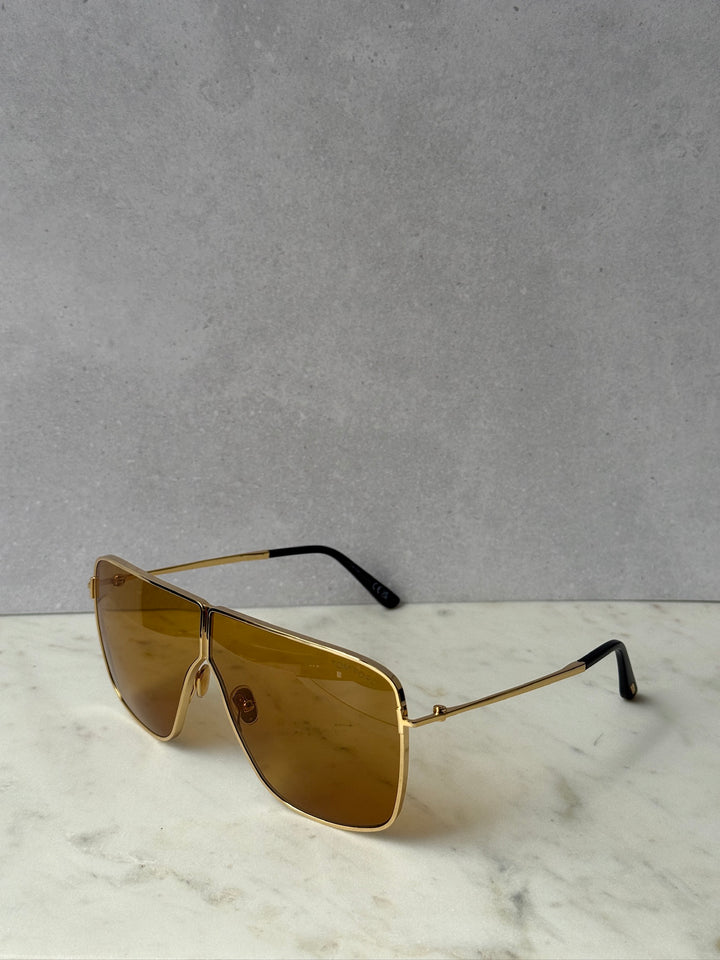 Gold square aviator sunglasses with amber lenses, side profile