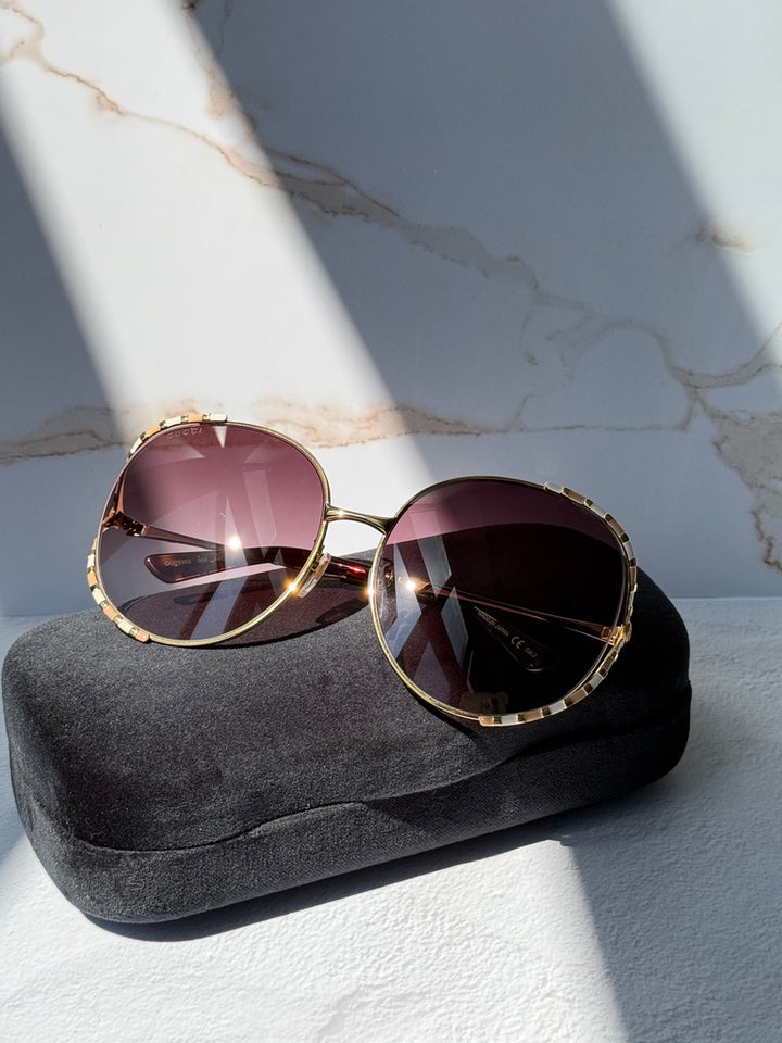 Gucci GG0595S Oversized Cutout Round Sunglasses in Brown Gradient