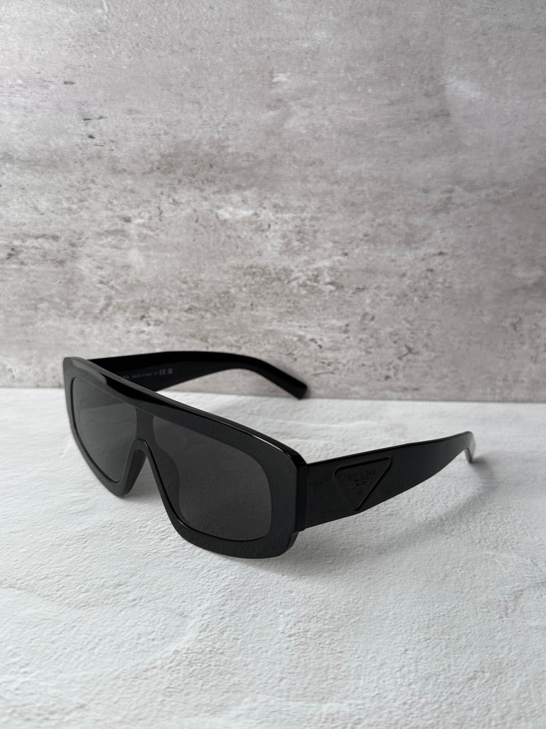 Black PRADA rectangular sunglasses with dark lenses and slim curved temples