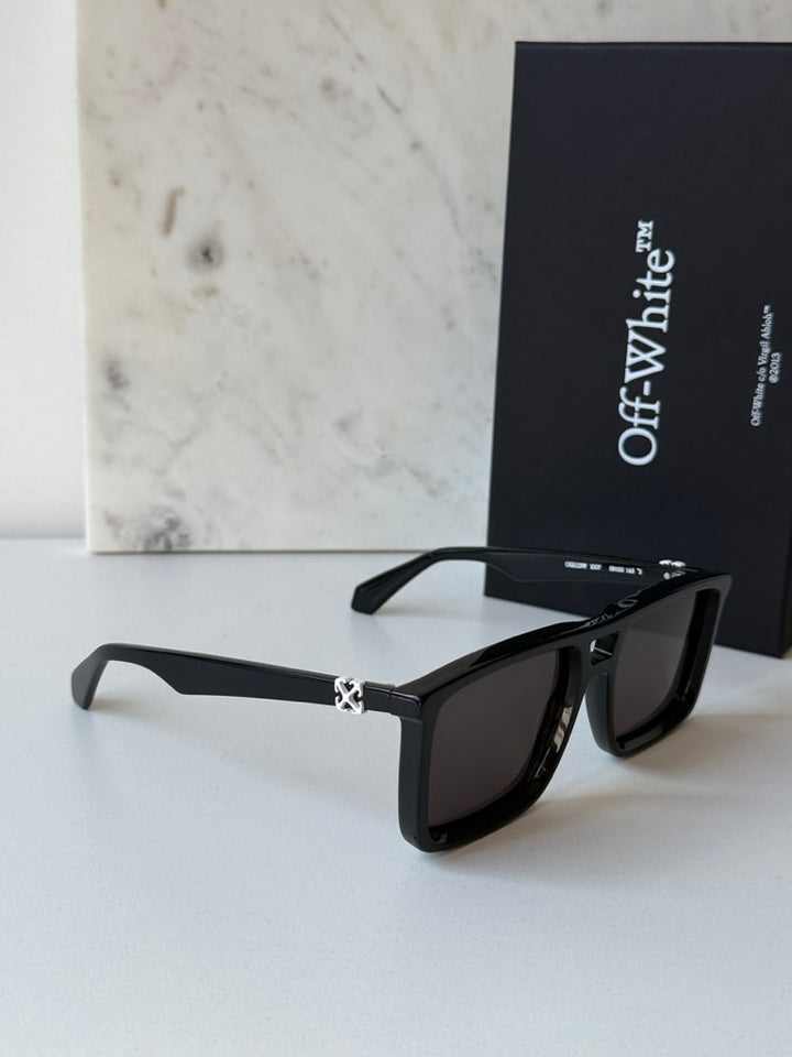 Off White aviator sunglasses, black frame, dark lenses, front angled view