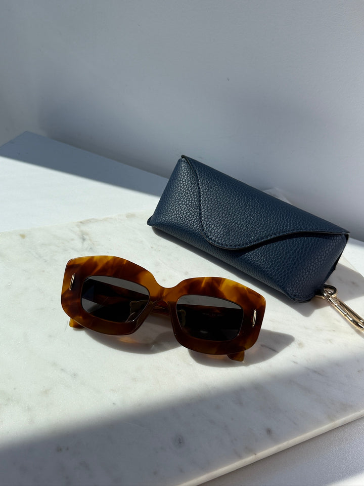 Loewe Havana brown anagram sunglasses with dark lenses and blue storage pouch