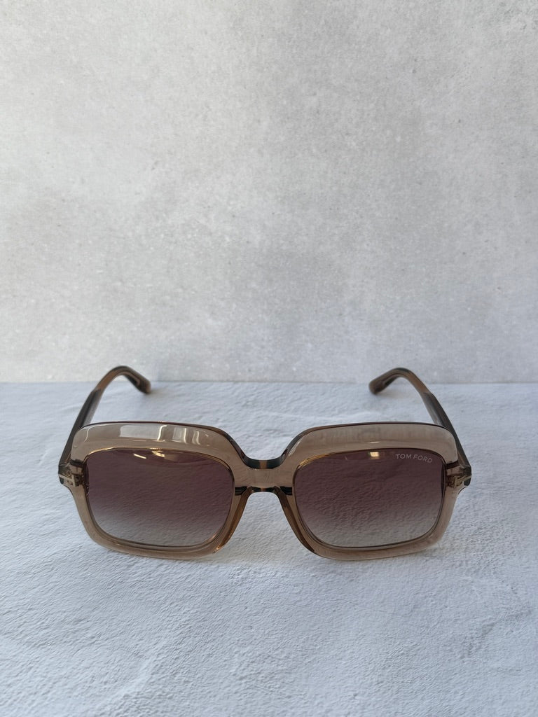 Square sunglasses with translucent frame and dark tinted lenses, front view