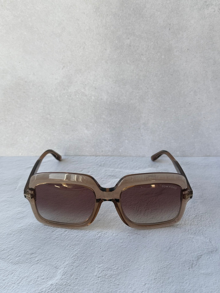 Square sunglasses with translucent frame and dark tinted lenses, front view