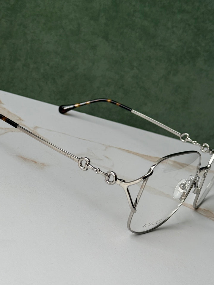 Gucci GG0973O Marcos de metal plateado