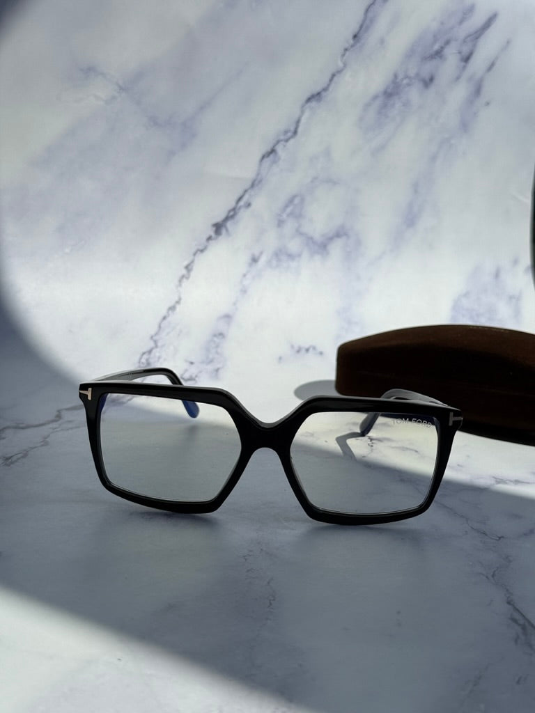 Tom Ford black clip-on sunglasses, front view with squared frame and tinted lenses