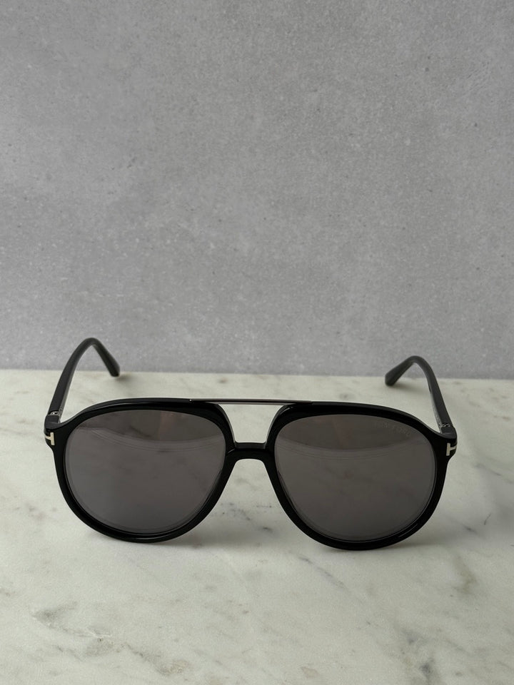 Black oversized aviator sunglasses with dark lenses, front view