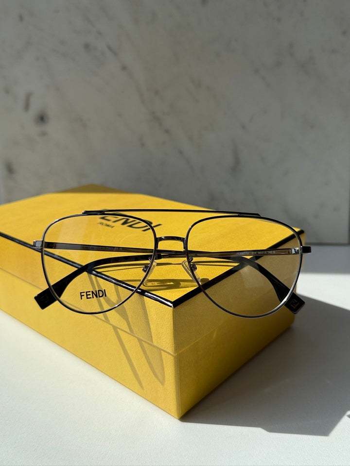 Fendi pilot aviator eyeglasses with clear lenses and dark temples on case