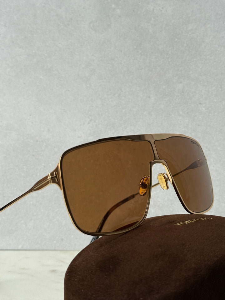 Gold-tone aviator sunglasses with brown gradient lenses and arched bridge