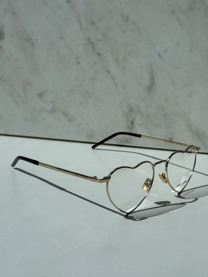Saint Laurent LouLou optical frames with silver-toned metal, heart-shaped clear lenses, black arms