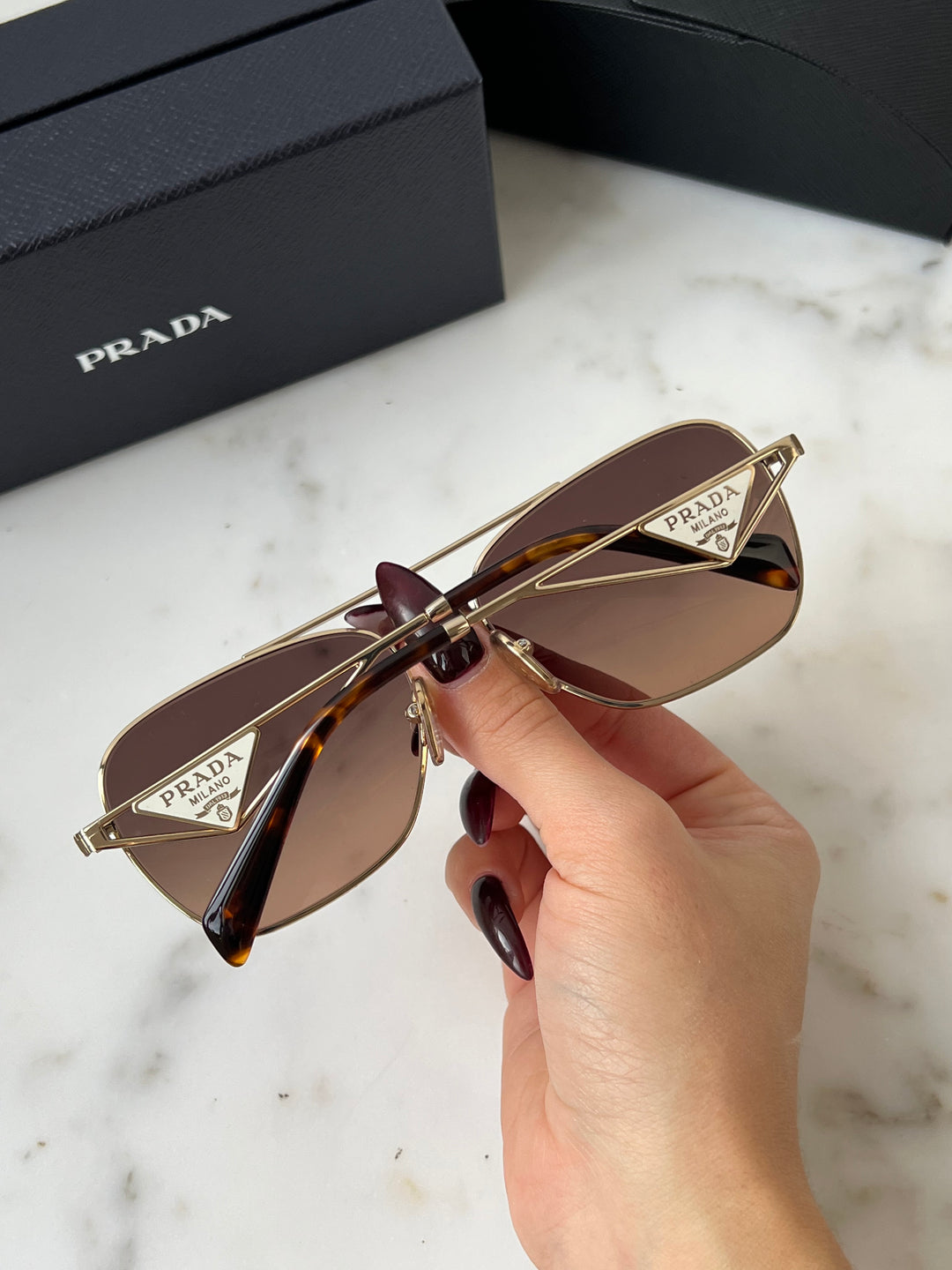 Prada PR A50S Sunglasses in Gold Brown
