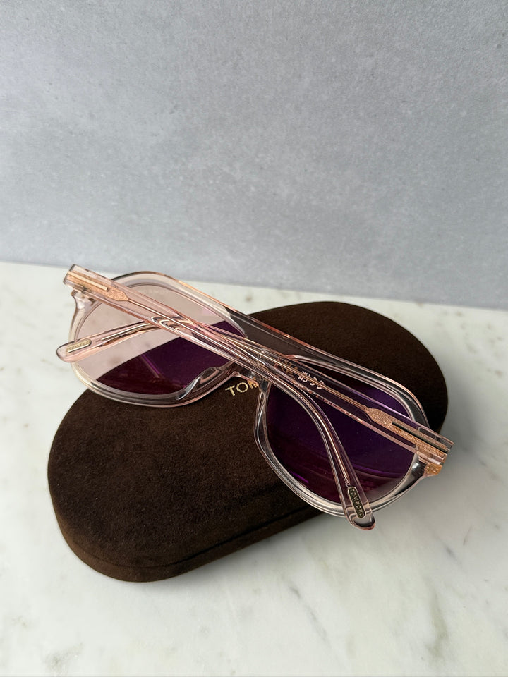 Pink aviator sunglasses with dark rose lenses and metal frame, side angle