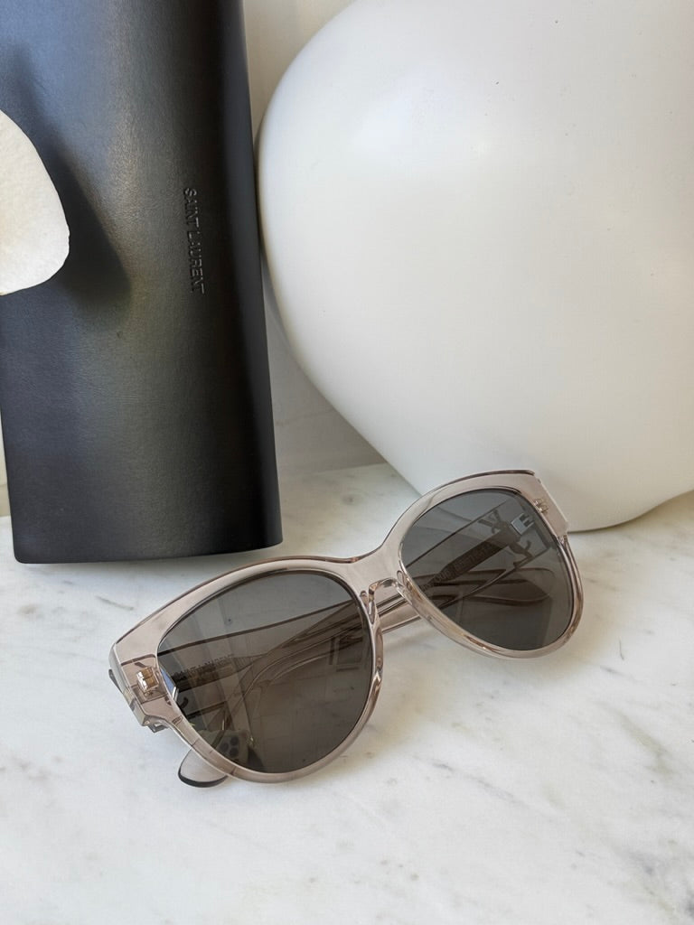 Cat-eye sunglasses in clear silver with tinted lenses, angled view