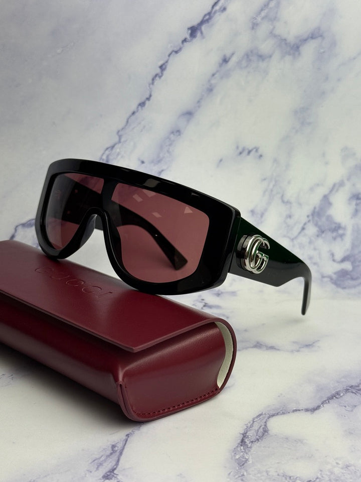 Gucci GG1257S Gafas de sol redondeadas con lentes marrones y rojos