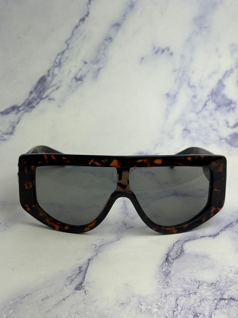 Gucci GG1257S Gafas de sol redondeadas con lentes marrones y rojos