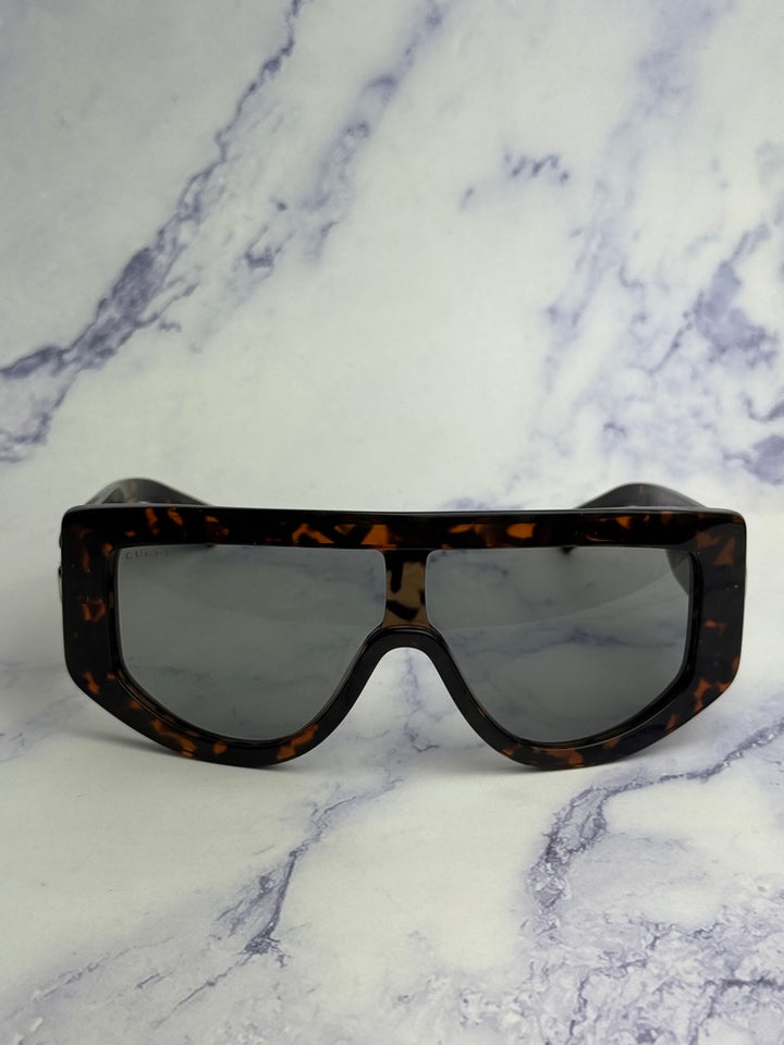 Gucci GG1257S Gafas de sol redondeadas con lentes marrones y rojos