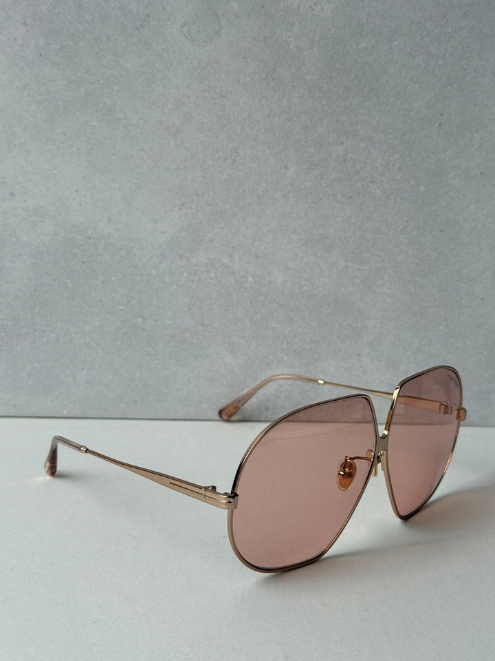 Rose gold oversized sunglasses with rose-tinted lenses and slim gold metal arms