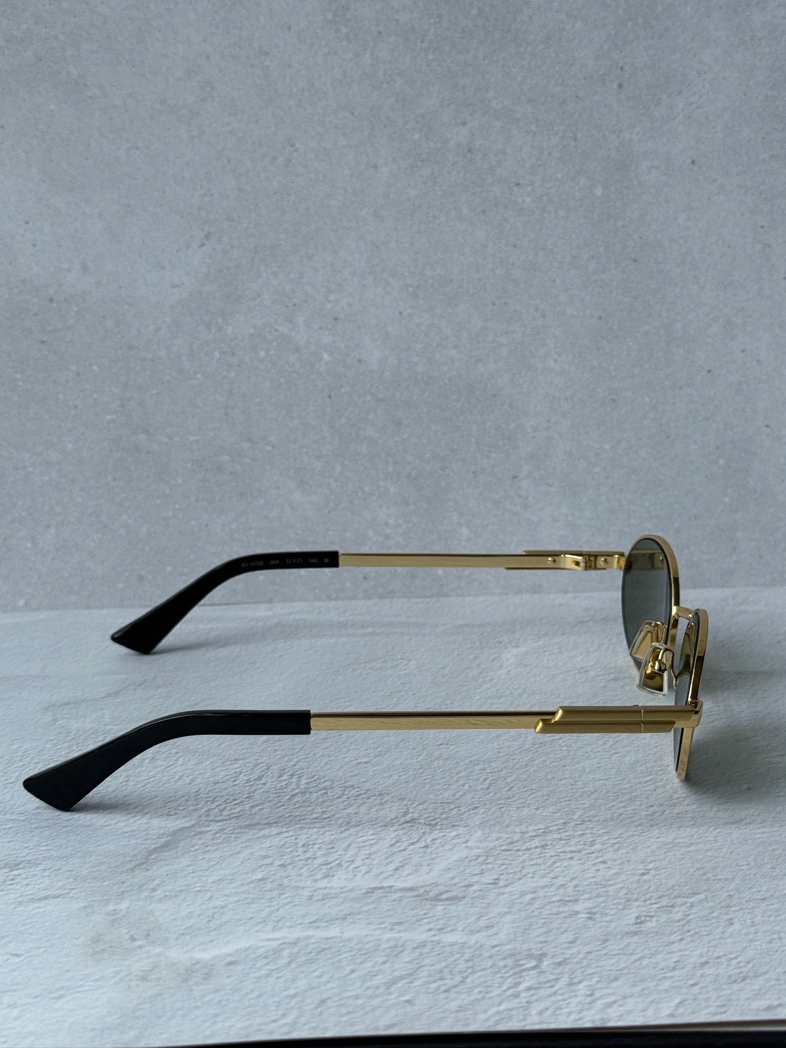 Bottega Veneta BV1470S Oval Gold Green Sunglasses | Designer Daydream