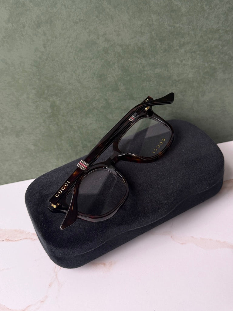 Havana brown square eyeglass frames with dark case and temple logo