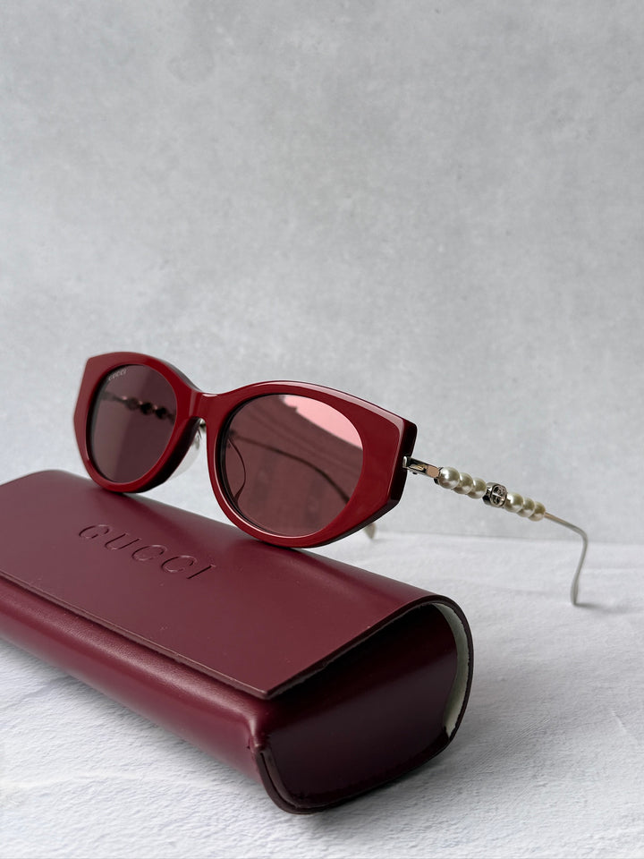 Gucci GG1257S Gafas de sol redondeadas con lentes marrones y rojos