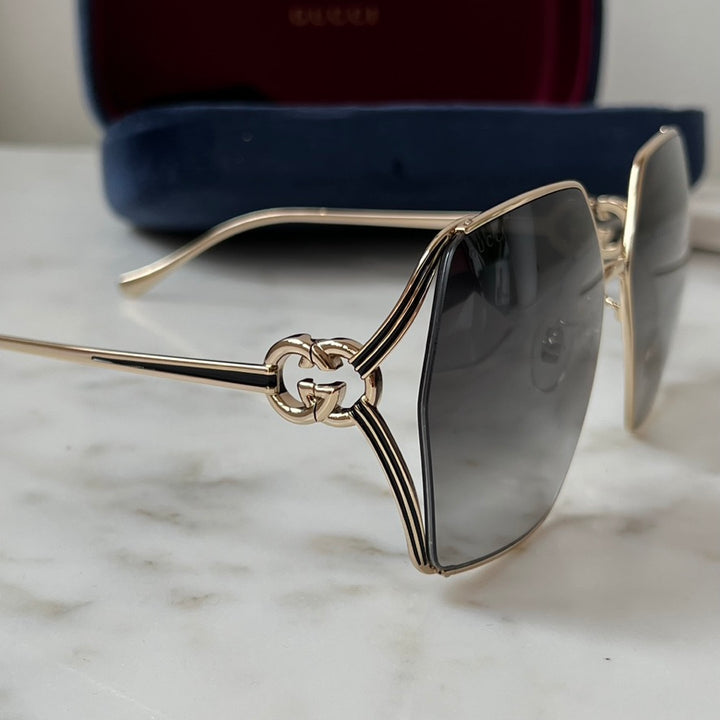 Gafas de sol de metal Gucci GG1322SA con lentes grises