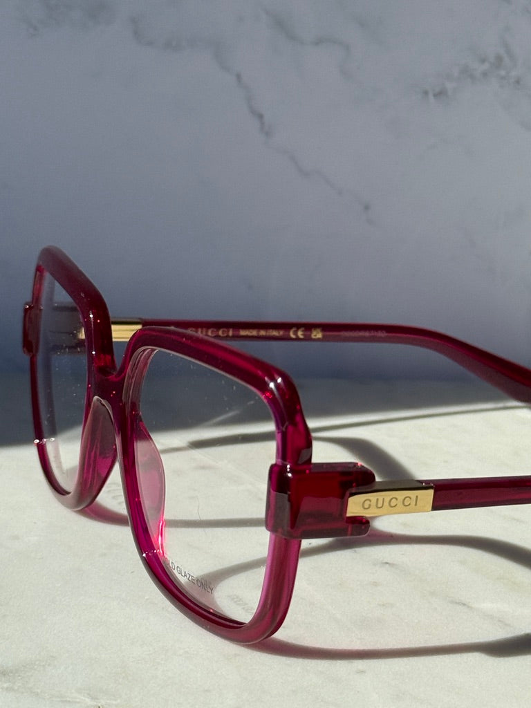 Pink red oversized square eyeglasses front-left view with clear lenses
