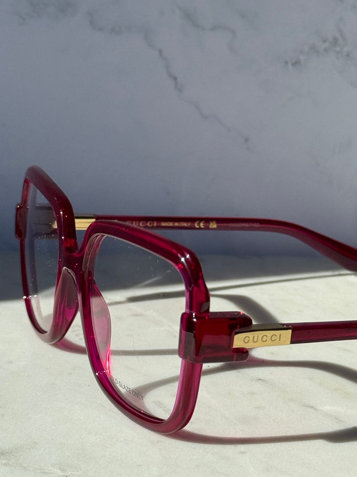 Pink red oversized square eyeglasses front-left view with clear lenses