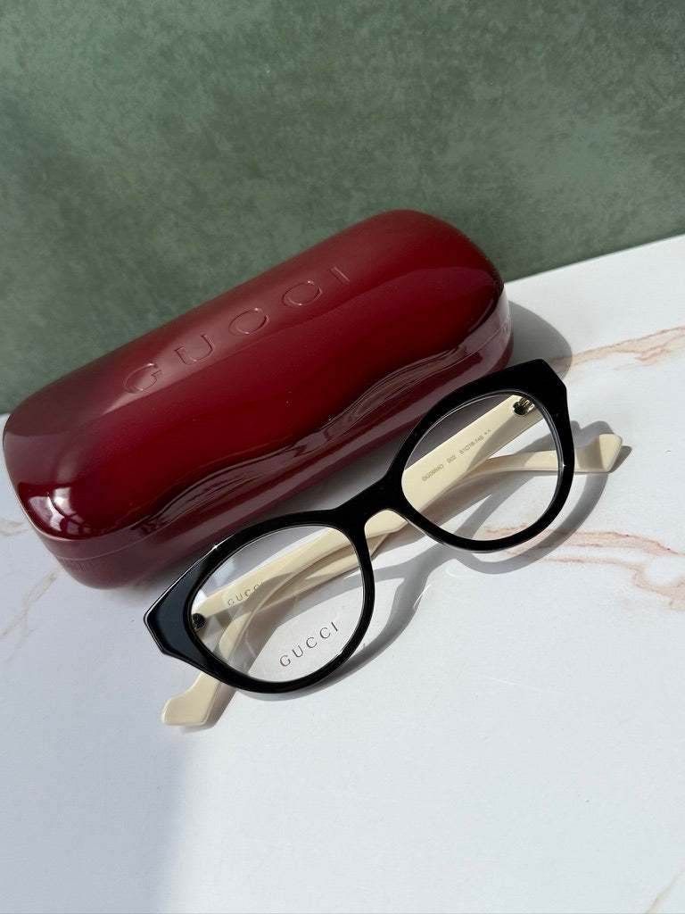 Monturas estilo ojo de gato Gucci GG0959O en negro marfil 