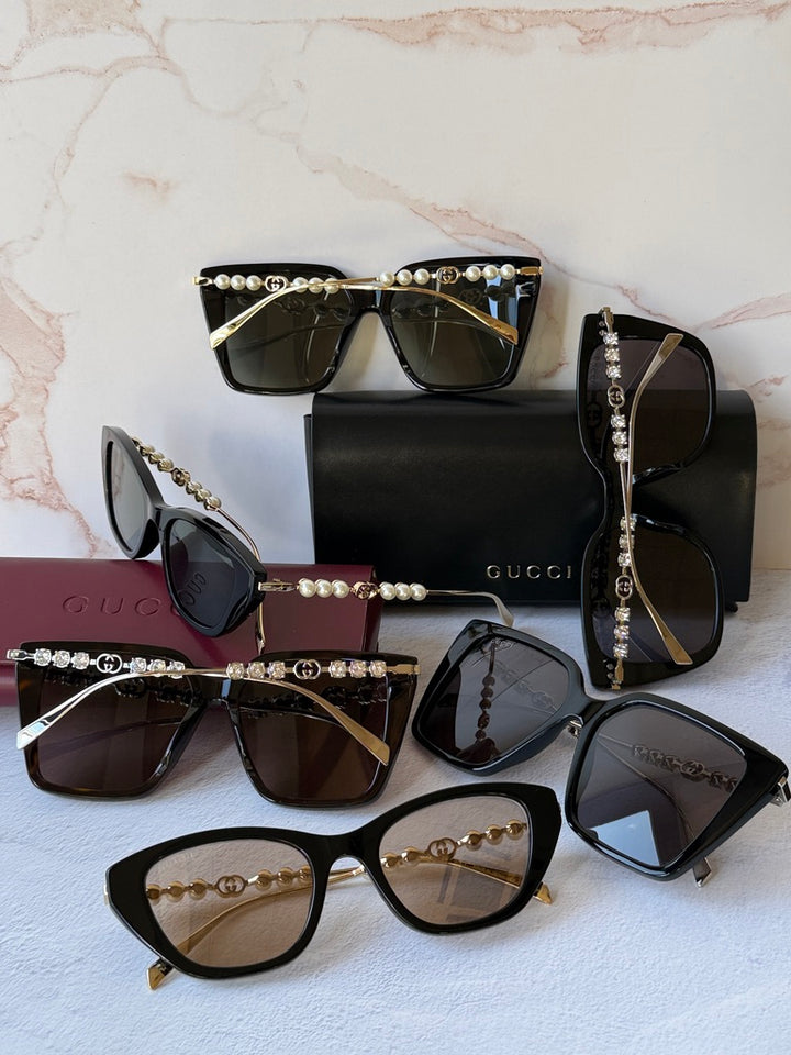 Gucci GG1257S Gafas de sol redondeadas con lentes marrones y rojos
