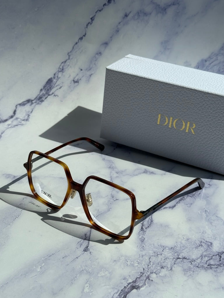 Havana brown square eyeglasses with Dior logo beside white Dior gift box
