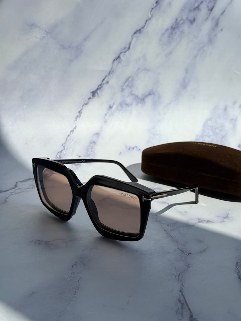 Tom Ford black clip-on sunglasses with tinted lenses and gold-tone hinge detail