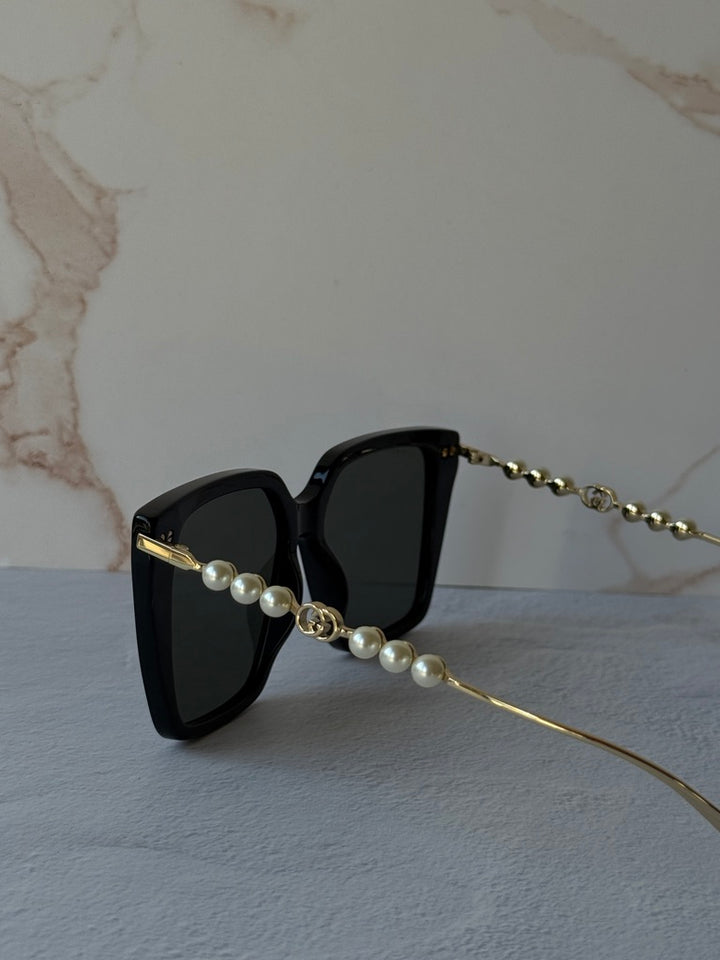 Gucci GG1257S Gafas de sol redondeadas con lentes marrones y rojos